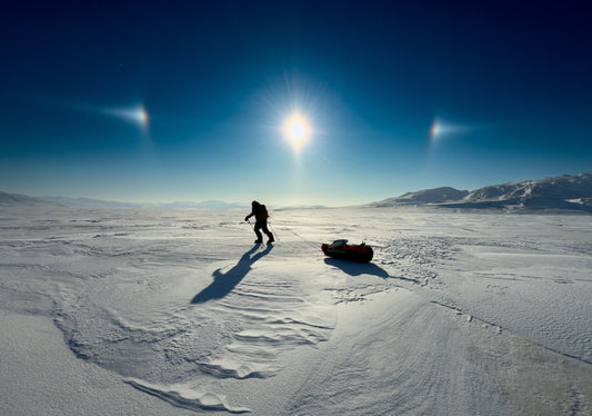 Ray Zahab and Kevin Vallely hauling sleds through deep Arctic snow on Ellesmere Island.